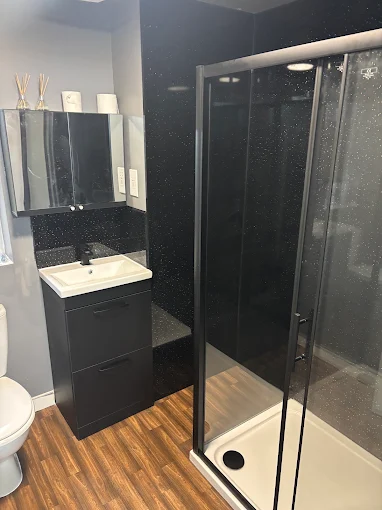 Black sparkle shower room installed by Aburrow Plumbing and Heating